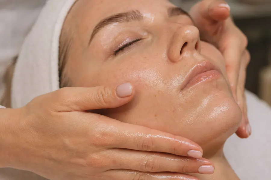 Client relaxing during a facial at Tally Brow Studio in Tallahassee