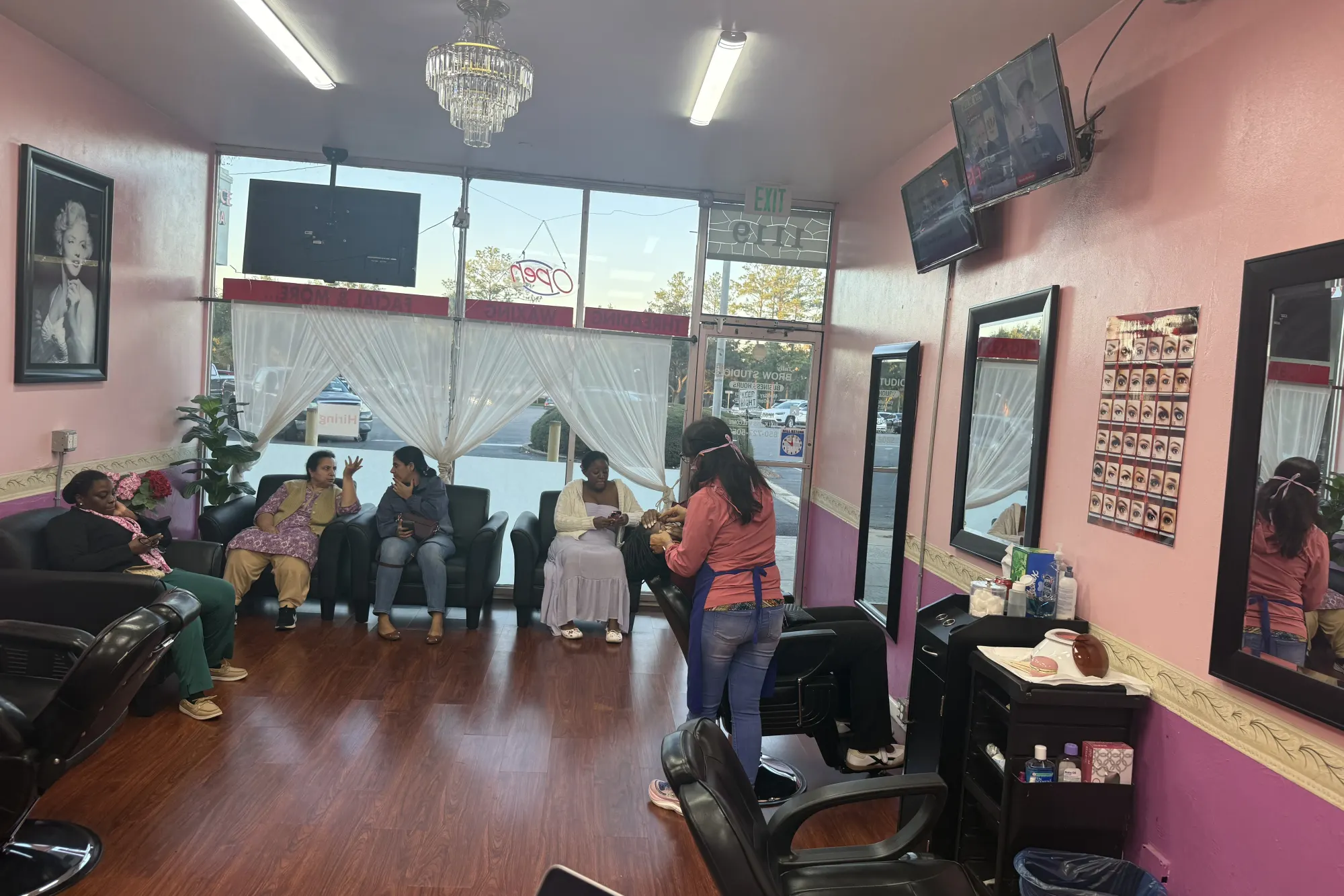 Pink-walled waiting area inside Tally Brow Studio on Apalachee Parkway in Tallahassee